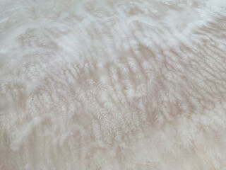 Aerial close up of the surface of the huge salt flats Salinas Grandes de Jujuy in northern Argentina while traveling South America