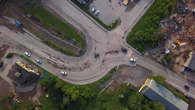 View from the height. Clip. A small fork in the road of cars with fast-moving vehicles.