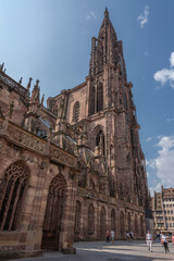 Fototapeta na wymiar Strasbourg, France - 06 26 2023: Strasbourg cathedral: View of the cathedral and the city around from the bottom.