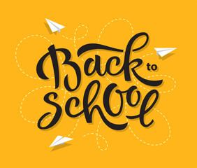 Back to school hand drawn lettering with flying paper planes on a background.
