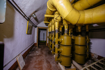 Old rusty air filtration and ventilation system in abandoned Soviet bunker or bomb shelter