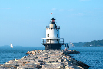 Fototapeta na wymiar Spring Point lighthouse on a warm summer day in Portland Maine, tourist attraction in Maine.