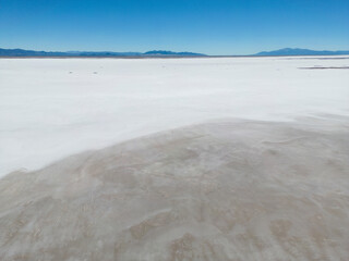 Aerial view of the huge salt flats Salinas Grandes de Jujuy in northern Argentina while traveling...