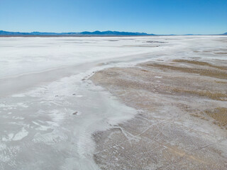 Aerial view of the huge salt flats Salinas Grandes de Jujuy in northern Argentina while traveling...