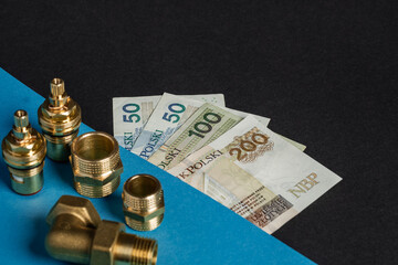 warsaw, poland - 07 07 2023: Polish banknotes of PLN on a black and blue background, next to the...