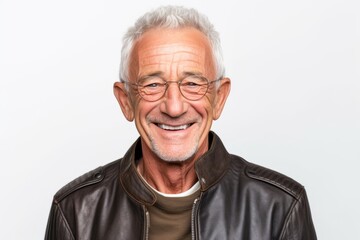 man in his 60s that is wearing a trendy faux leather jacket against a white background