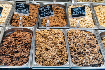 Assorted dried fruits in a store window.