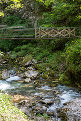 Suspended, mountain bridge crossing Soca river, Slovenia