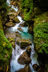 Amazing Soca river rocky, canyon landscape in Triglav mountain national park, deep in slovenian Alps hidden in dense vegetation