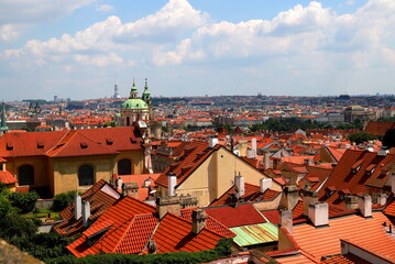 Obraz premium Prague, Czech Republic. Mala Strana of Prague. Top view of downtown, panorama. Ancient medieval buildings with red tiled roofs, church, tower, castle