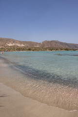  People relaxing on the famous pink coral beach of Elafonisi on Crete, Mediterannean sea, Greece