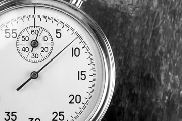 mechanical analog stopwatch on a colored background. Time part precision. Measurement of the speed...