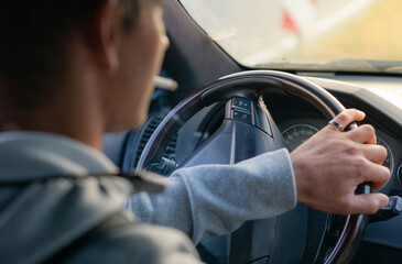 Driving with a car . View from car inside. Smoking man driving with a car