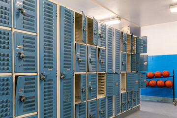 Old bent blue metal gym, gymnasium, lockers.	
