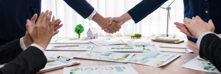 Business people hand shake in Eco corporate meeting room after made successful agreement deal on...