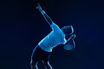 Padel tennis player. Padel open tour. Man athlete with paddle tenis racket on blue background. Sport concept. Download a high quality photo for sports website. - 621641694