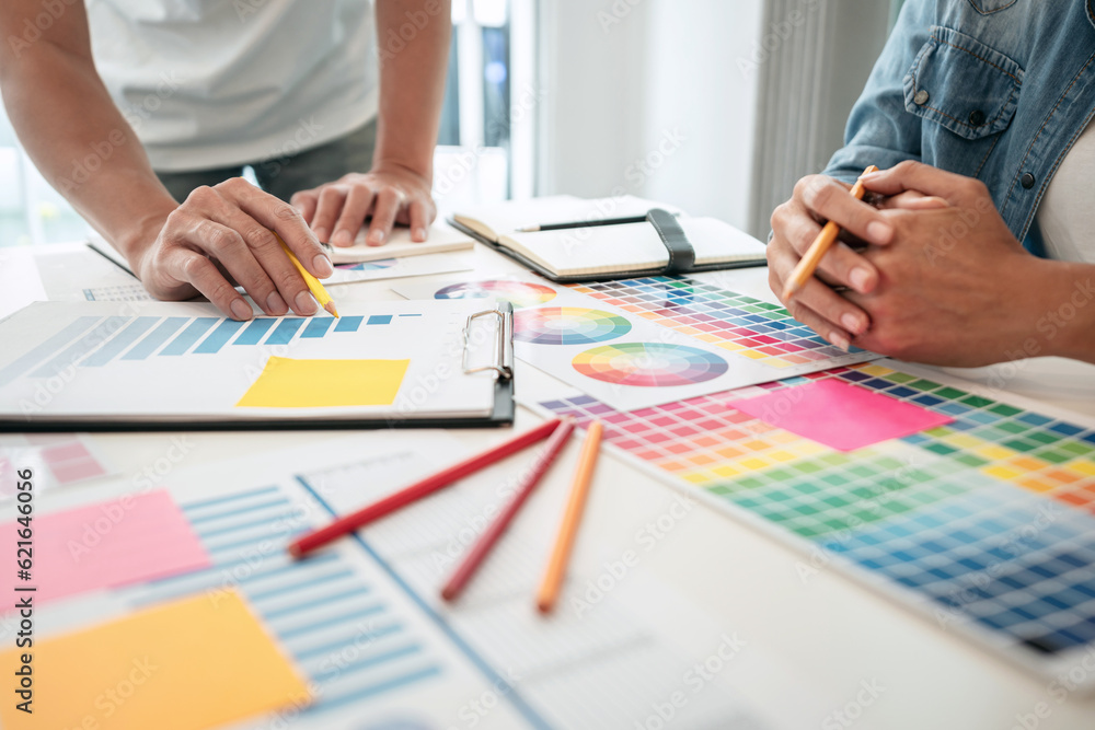Poster two creative graphic designer team working on color selection an