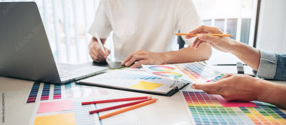 Poster two creative graphic designer team working on color selection an