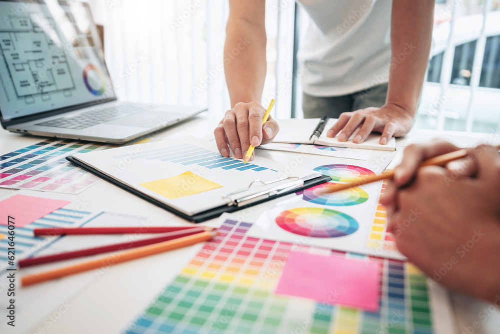 Poster two creative graphic designer team working on color selection an