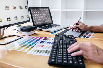 Image of male creative graphic designer working on color selecti