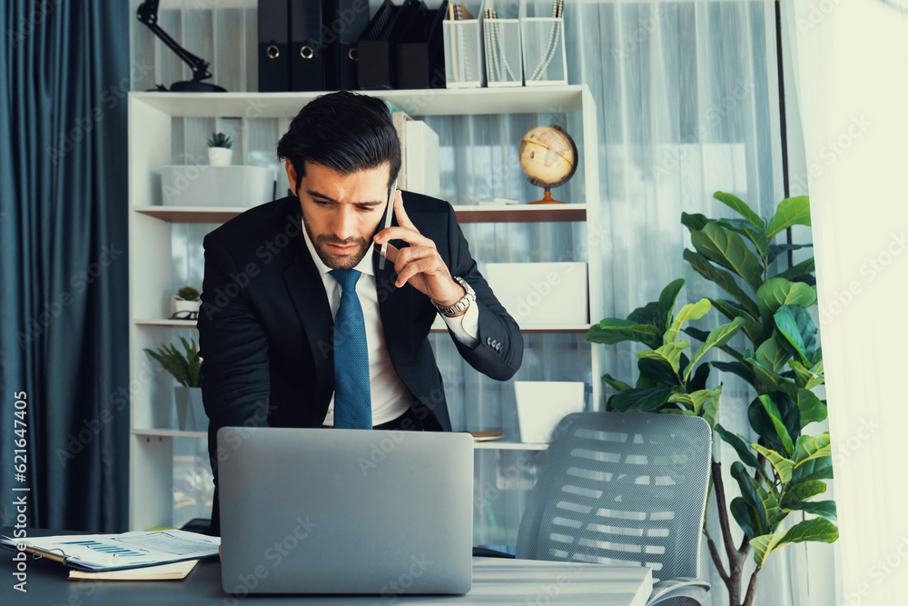 Aufkleber diligent businessman busy talking on the phone call with clients while working with laptop in his of