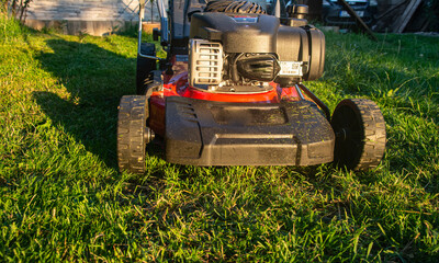 Lawn mover on green grass. Machine for cutting lawns.
