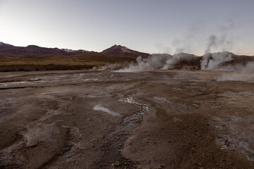 Exploring the fascinating geothermic fields of El Tatio with its steaming geysers and hot pools high up in the Atacama desert in Chile, South America