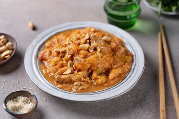 Chicken in curry sauce served in bowl