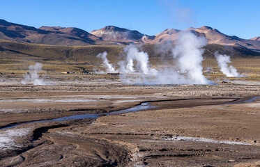 Exploring the fascinating geothermic fields of El Tatio with its steaming geysers and hot pools high up in the Atacama desert in Chile, South America