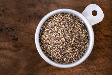 Ground Black Pepper in a Measuring Cup