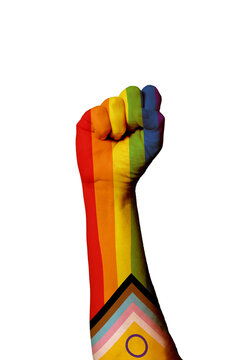 Vertical shot of the Pride Intersex Rainbow Progress Flag painted on human raised fist