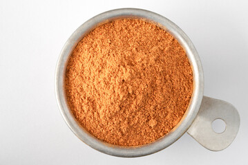 Goji Berry Powder in a Measuring Cup