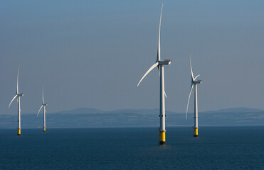 Burbo Bank, Liverpool Bay, England UK.  8 June 2023.  Viewed from the sea turbines on Burbo wind farm off the UK coast.