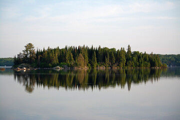 Fototapeta na wymiar reflection of an island on a lake