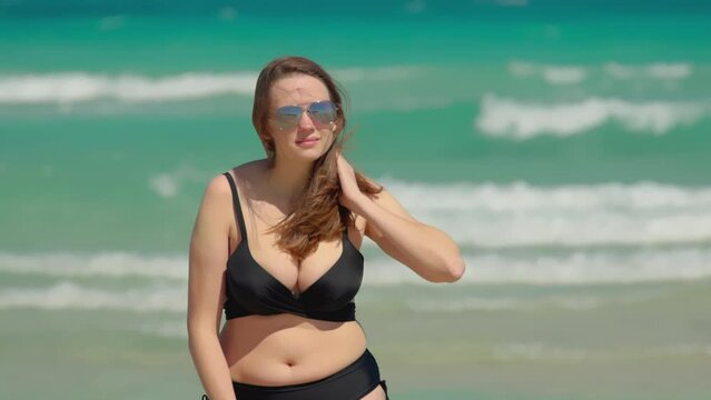 Beautiful girl at Miami Beach on a windy day in extreme slow motion - Miami Florida travel photography 