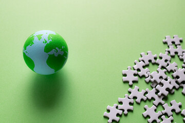 Earth ball with pieces of fuzzle.