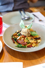Spaghetti with Crispy Gourami Fish