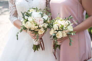 witnesses at the wedding of friends with bouquets congratulate the bride