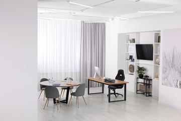 Naklejka na ściany i meble Stylish office with comfortable furniture and tv zone. Interior design