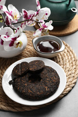 Fototapeta na wymiar Composition with aromatic pu-erh tea on grey table