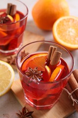 Aromatic punch drink and ingredients on table