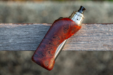 high end rebuildable dripping atomizer with stabilized natural redwood burl regulated box mods on...