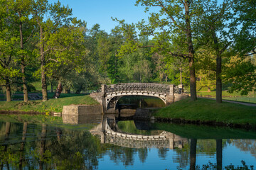 View of the cast-iron openwork bridge across the water maze channel near the White Lake in the...