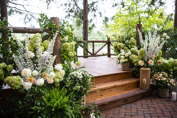 Fototapeta na wymiar Botanical Garden Wedding Flowers Event Bouquet Forest Fairytale Flower Events Table Setting Centerpiece Arrangement Design Candles