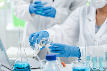 medicine research in chemical laboratory, chemist scientist working with liquid experiment test analysis by using scientific tube beaker glassware, chemistry science pharmaceutical medical lab concept