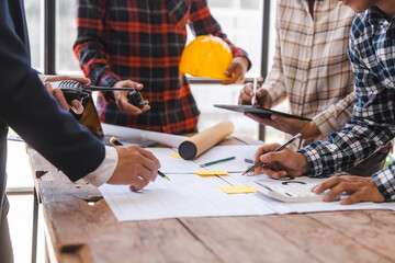 Factory Meeting Room of architect engineer meeting at working desk of blueprints construction concept. Engineer people concept