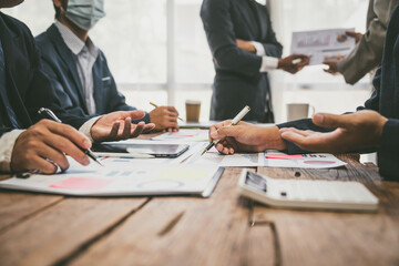 Group of business people doing bookkeeping, colleagues discussing, start planning, sharing ideas, working together in modern office. Meeting Teamwork successful business job interview ideas