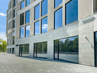office building with glass facade in bright sunny day. contemporary urban architecture.