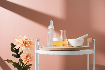 The natural beauty skin care with pestle and mortar on a pastel background. Cosmetic concept obvious copy space.