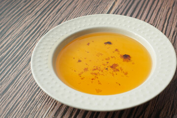 Used vegetable oil in a plate .